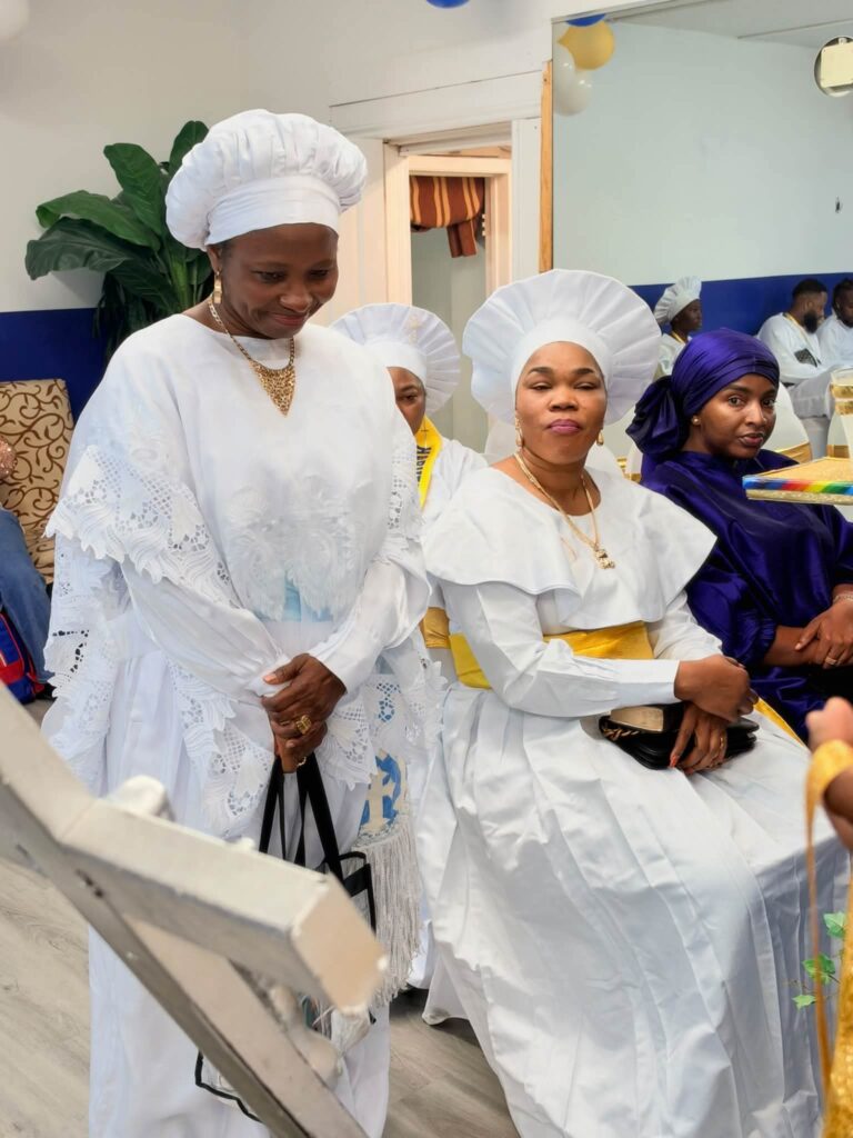 Women in white garments and head-ties at the Harvest Thanksgiving Service