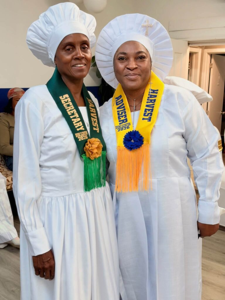 Harvest Secretary in green sash and Harvest Adviser in yellow sash