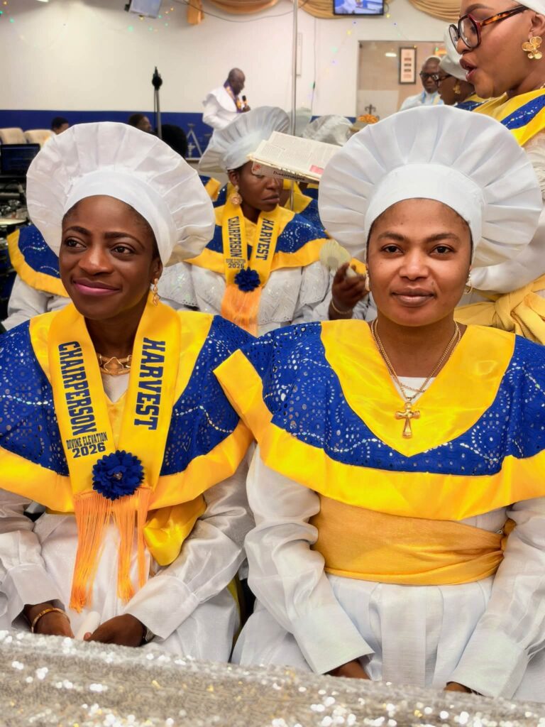 Harvest Chairperson and a member in blue and gold harvest collars